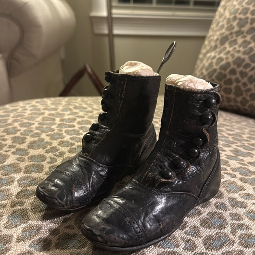 Vintage children’s button up boots with the tool to button them